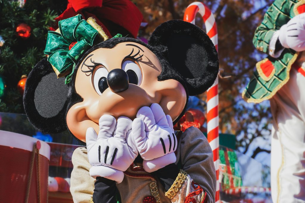 Minnie Mouse holding her hands to her lips in surprise.