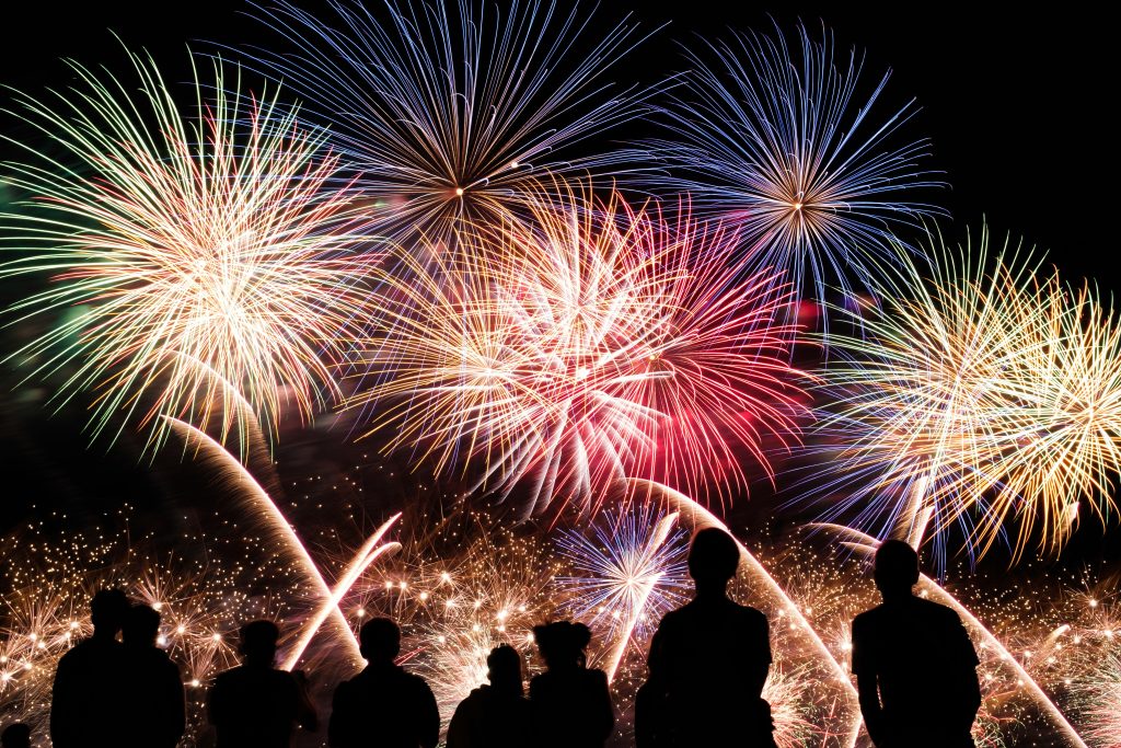fireworks with people watching