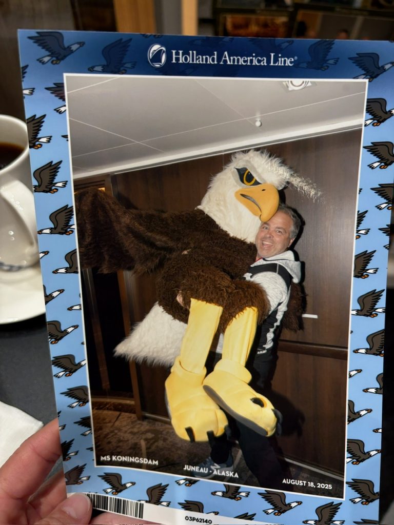 man lifting eagle mascot