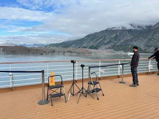 man watching out from cruise ship deck