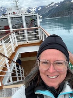 Woman in black hat on cruise ship deck