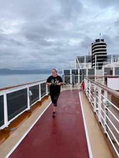 woman running on cruise ship jogging track