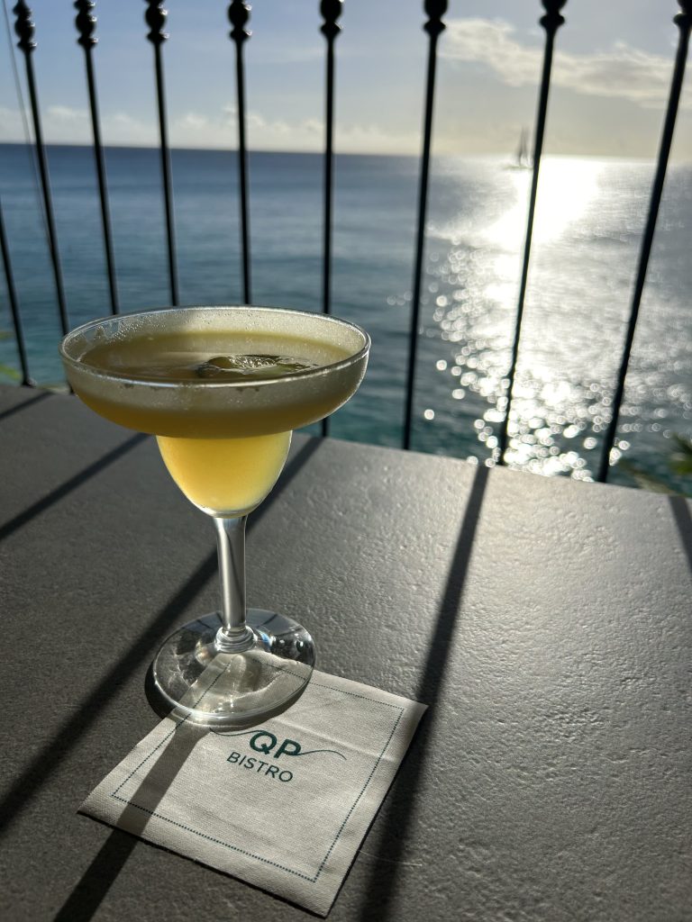 Martini against ocean backdrop