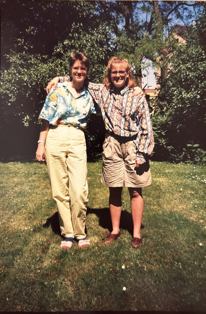 Two teens with arms around each other