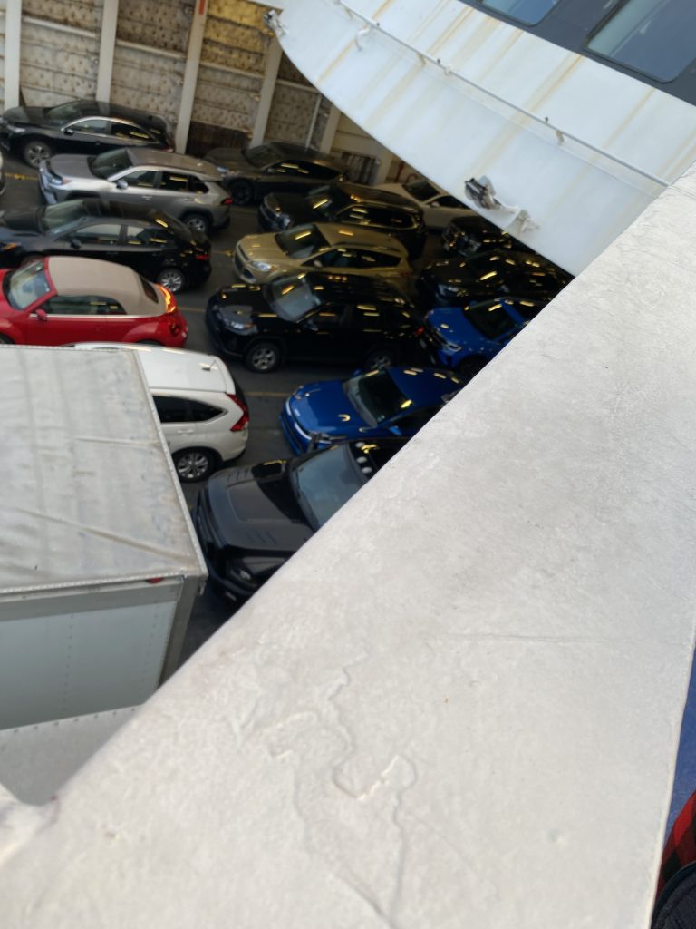 cars parked close on ferry