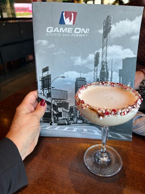 fancy martini in front of menu
