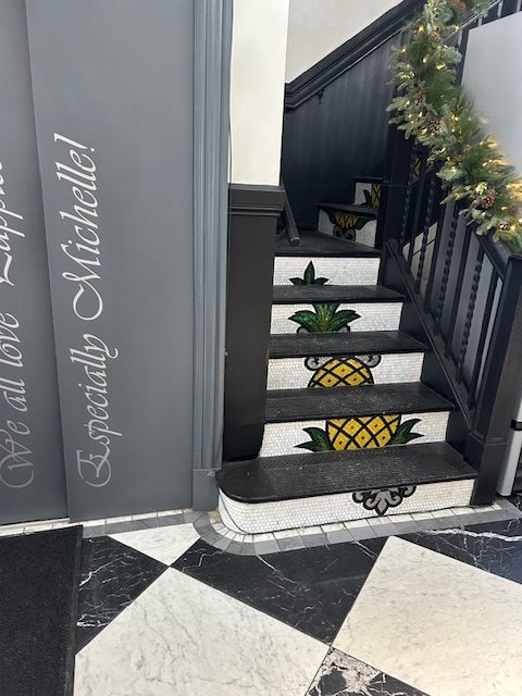 stairwell with funky pineapple on stairs