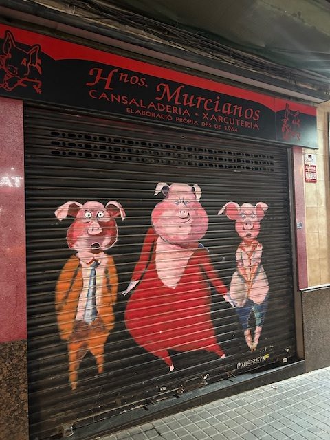 three pigs dressed up in fancy clothing
