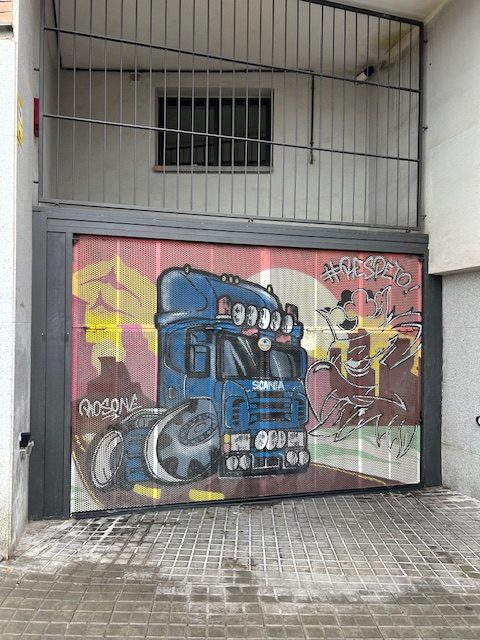 blue truck cab painting on business door