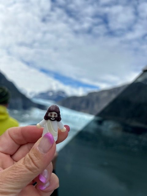 Jesus statue on cruise ship in front of Margerie Glacier