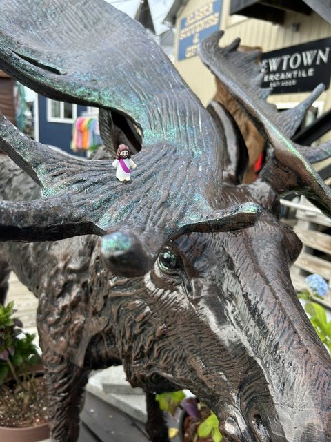 Mini Jesus statue on a moose statue