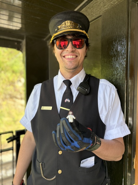 train conductor holding Jesus statue